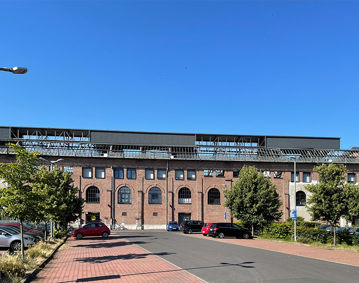 aik erwirbt Wohn- und Geschäftshaus in Industriedenkmal